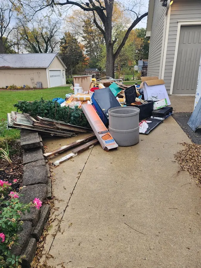 Dumpster being loaded with debris for 3 Yard Dumpster Rental in Compton